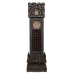 A Chinese lacquered wood 'dragon' longcase clock, early 20th century, with waisted lotus stand inset