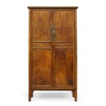 A Chinese huanghuali tapered cabinet, yuanjiaogui, late Qing dynasty, the flat framed top with