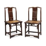 A pair of Chinese hongmu chairs, 18th / early 19th century, the shaped top rails above serpentine