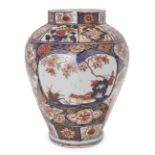 A Japanese Arita octagonal jar, 17th century, decorated in the Imari palette with panels of