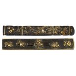Two Japanese gilt bronze knife handles, 19th century, one with parcel gilt mytical beasts, the other