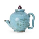 A Japanese monochrome turquoise teapot, early 20th century, of ovoid form, impressed mark to base,