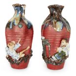 A pair of Japanese Sumida Gawa vases, Meiji period, each ribbed body in red glaze with a flambe