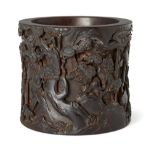 A Chinese zitan 'er lang sou shan' brush pot, 18th/19th century, finely carved with demons and
