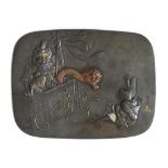 A Japanese silver, gold and copper inlaid bronze plaque, Meiji period, decorated with a scene of