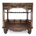 A Chinese four-poster bed, jia zi chuang, early 20th century, standing on lacquered and gilt painted