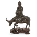 Property of a Gentleman (Lots 55-80) A Chinese bronze figure of a sage riding an ox, Ming dynasty,