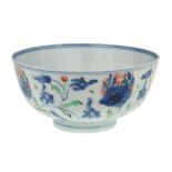 A Chinese doucai bowl, 18th century, painted with a continuous pattern of flowering stems, 11.5cm