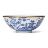 A Chinese blue and white bowl, 19th century, painted with boats and pagodas in a coastal