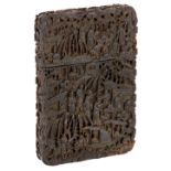 A Chinese tortoiseshell card case, mid- 19th century, intricately carved with figures in a village