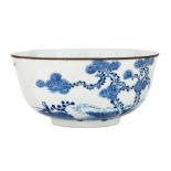 A Chinese blue and white bowl, 18th century, rim mounted with metal, painted to the exterior with