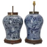 A pair of large Chinese blue and white 'peony and phoenix' jars, 18th century, painted with