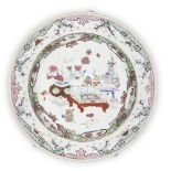 A Chinese export famille rose plate, 18th century, painted with vases of flowers on tables within