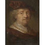 Follower of Govaert Flinck, Dutch 1615-1660- A man, head and shoulders, in a brown cloak, velvet cap