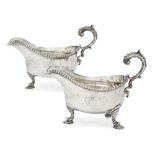 A pair of George II silver gravy boats, London, 1759, William Skeen, each with flying triple