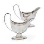 A pair of George III silver pedestal sauce boats, London, 1783, Hester Bateman, each designed with