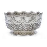 A Victorian silver punch bowl, London, 1888, Sibray, Hall & Co., the body repousse decorated with