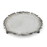 A large Edwardian silver salver with scrolling border, Birmingham, 1902, Elkington & Co., of shaped,