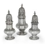 A set of three George II silver casters, London, 1743, Elizabeth Godfrey, of baluster form, with