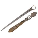 A Maltese coin-set paper knife, with gilded blade to openwork and coin-set handle, the larger coin a