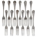 A composite set of twelve three pronged 18th century table forks, comprising three London, 1758,