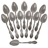 A set of twelve Canadian silver table spoons, P.W. Ellis & Co., Ontario, 1872-1928, with floral