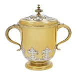 An Edwardian silver gilt twin handled cup and cover, London, 1908, Goldsmiths & Silversmiths Co.,