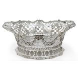 A late Victorian silver cake basket, London, 1899, Daniel & John Wellby, of shaped oval form, the