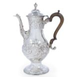 A George III silver coffee pot, London, 1783, John Kidder, of baluster form, the repousse floral