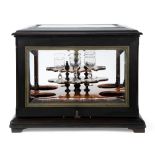 A Napoleon III ebonised liqueur cabinet, probably by Paul Sormani, third quarter 19th century, the