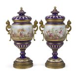 A pair of Sevres-style gilt-bronze mounted pot-pourri vases and covers, late 19th century, the