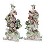 A pair of Bow porcelain figures of a shepherd and shepherdess, c.1765, iron-red anchor and dagger