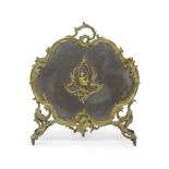 A French gilt bronze fire screen, late 19th century, with foliate scroll border set with a cherub
