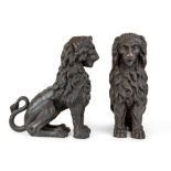 A pair of Italian carved wood models of seated lions, probably 17th century, 53cm high, 44cm long