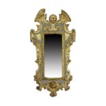 A small Italian carved gilt wood mirror, 20th century, with carved head to crest and mythical