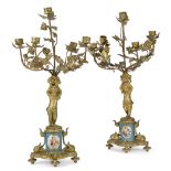 A pair of French Sevres style gilt-bronze and porcelain five light candelabra, 19th century, each