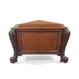 A French mahogany sarcophagus wine cooler, 19th century, the hinged top enclosing lined interior,