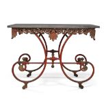 A French wrought iron butchers table, 19th century, black marble top above silver painted pierced