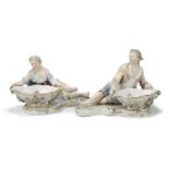 A pair of Meissen figural sweetmeat dishes, late 19th/early 20th century, blue crossed sword