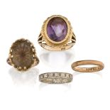 A group of four rings comprising: an oval amethyst ring, collet-set in chased mount to openwork