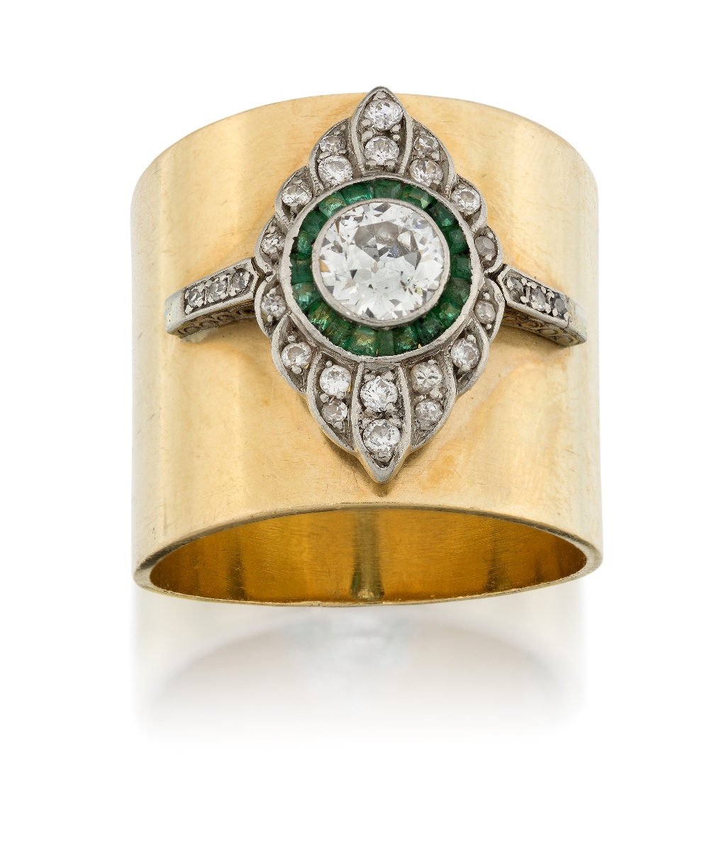 An emerald and diamond band ring, the central collet-set old brilliant-cut diamond to calibre