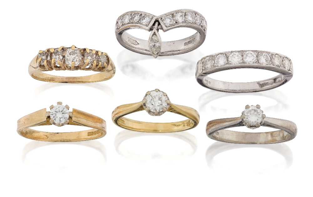 A group of six diamond rings comprising: three 18ct gold diamond single stone rings, each claw set