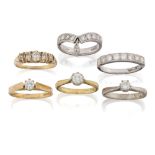 A group of six diamond rings comprising: three 18ct gold diamond single stone rings, each claw set