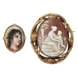 Two brooches, one a Victorian gold mounted shell cameo brooch the oval cameo depicting a seated lady