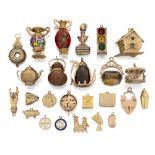 A collection of mostly 9ct gold charms, of various designs, and two fob seals, charms include: a