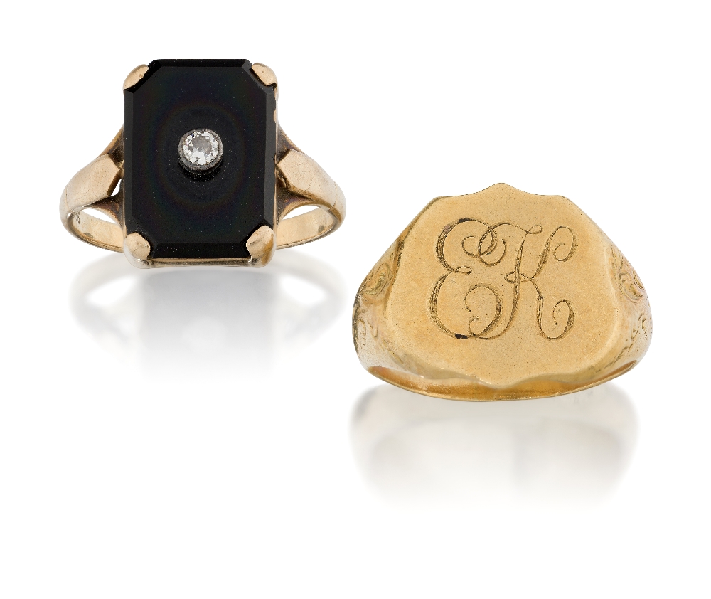 A diamond and onyx ring, the rectangular onyx panel with a collet set diamond accent, approx. ring