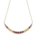 A ruby and diamond pendant necklace, designed as a crescent-shaped panel set with graduated