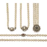 Three cultured pearl necklaces and a cultured pearl bracelet, one necklace with diamond clasp,