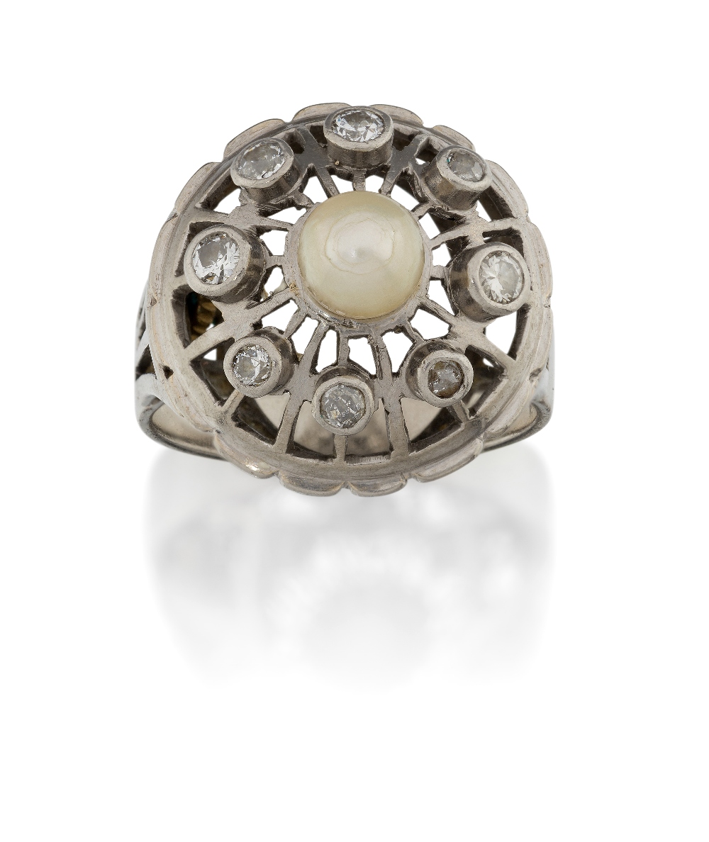 A diamond and cultured pearl ring, of domed design, the collet-set diamonds to an openwork mount