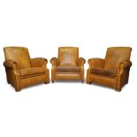 Designer Unknown, Three club armchairs, 20th century, Tan leather, black piping, beech feet, Each